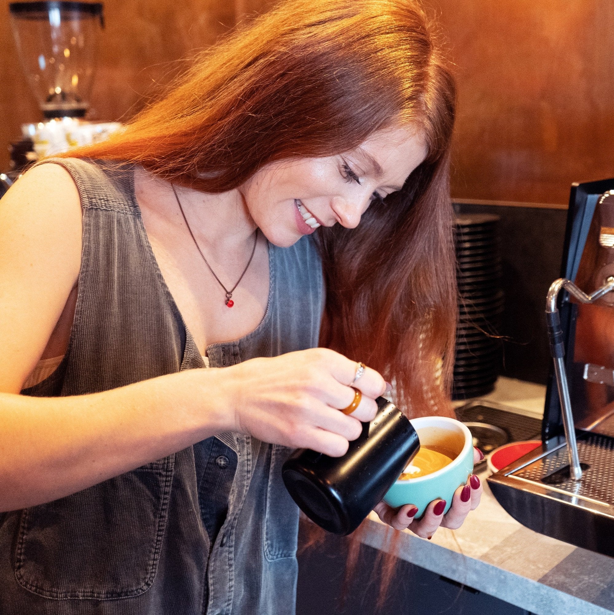 Reece, 200 Degrees Senior Head Barista pouring a coffee