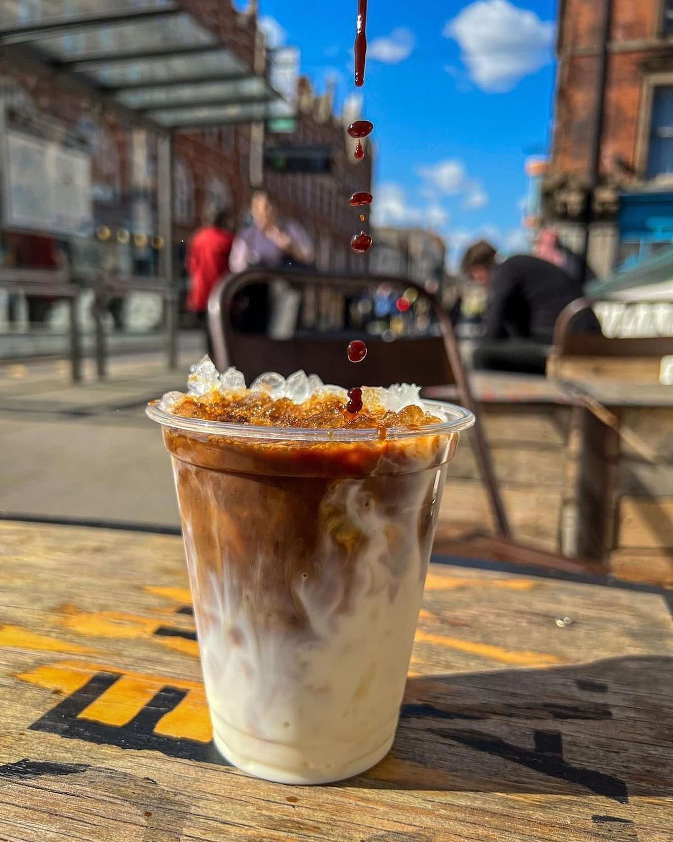 iced coffee on table in the sun 