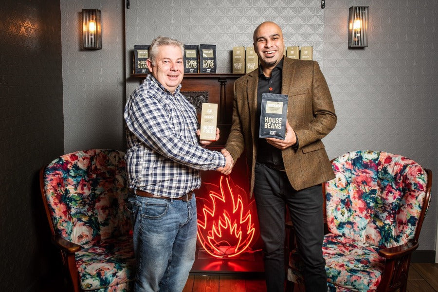 200 degrees co founder Rob Darby shaking hands with Marcellus Baz